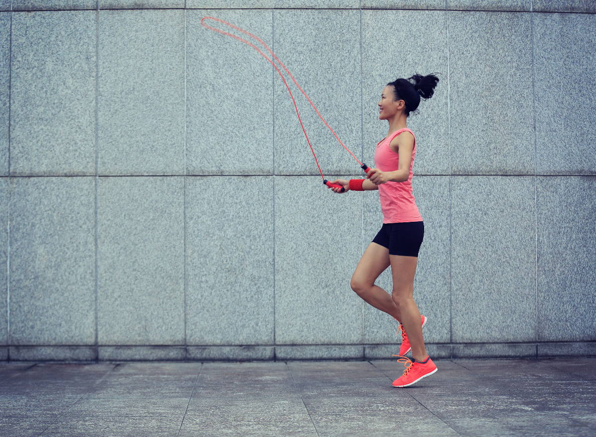 woman jumping rope outside