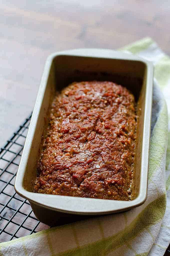 Keto meatloaf in pan on cooling rack