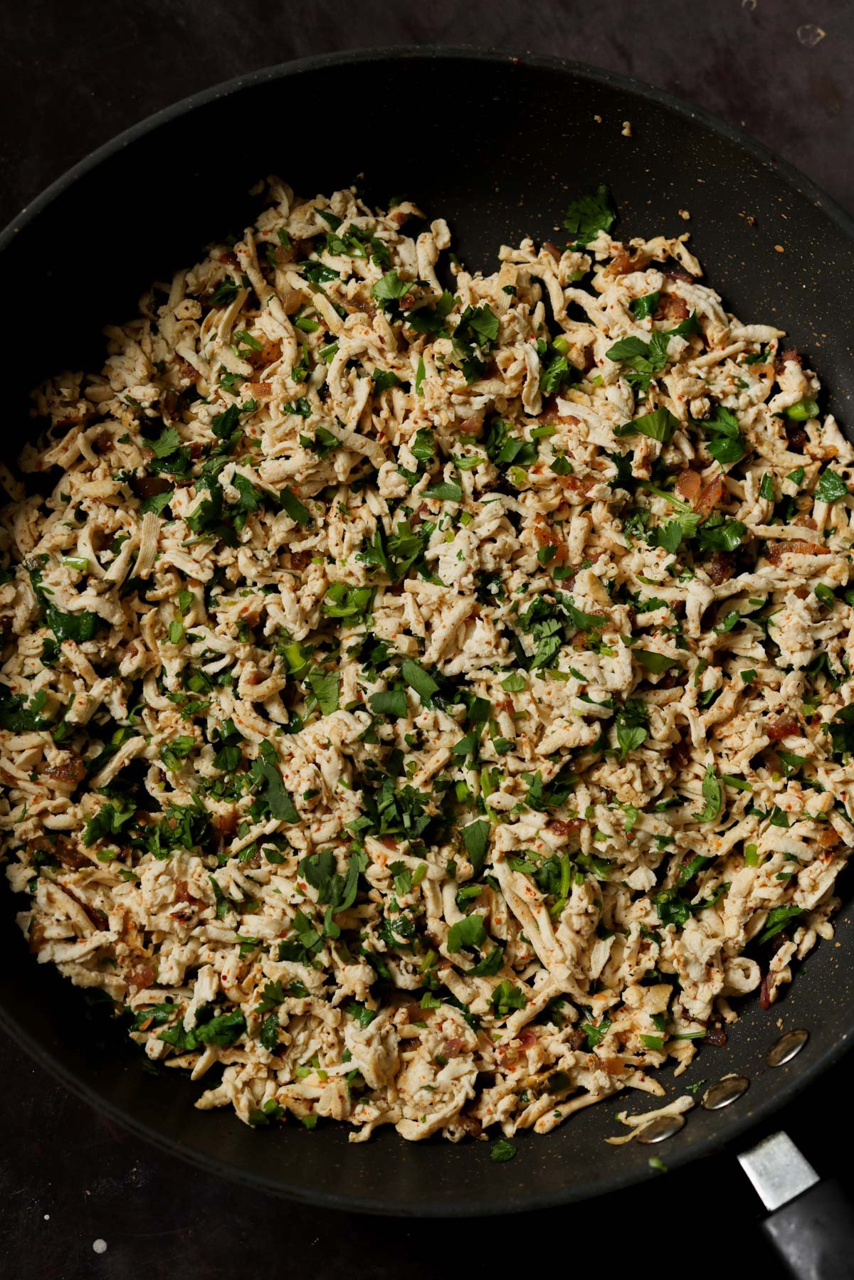 cilantro lime shredded tofu in a pan after cooking