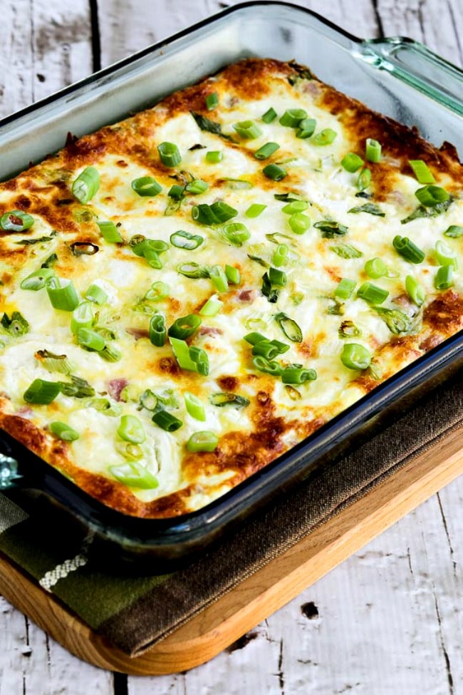 Close-up photo of Karyn's Breakfast Casserole with Artichokes, Goat Cheese, and Canadian Bacon, finished casserole in baking dish