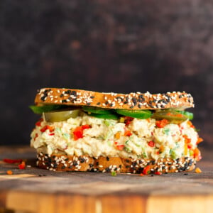 jalapeño popper chickpea salad sandwich on a chopping board