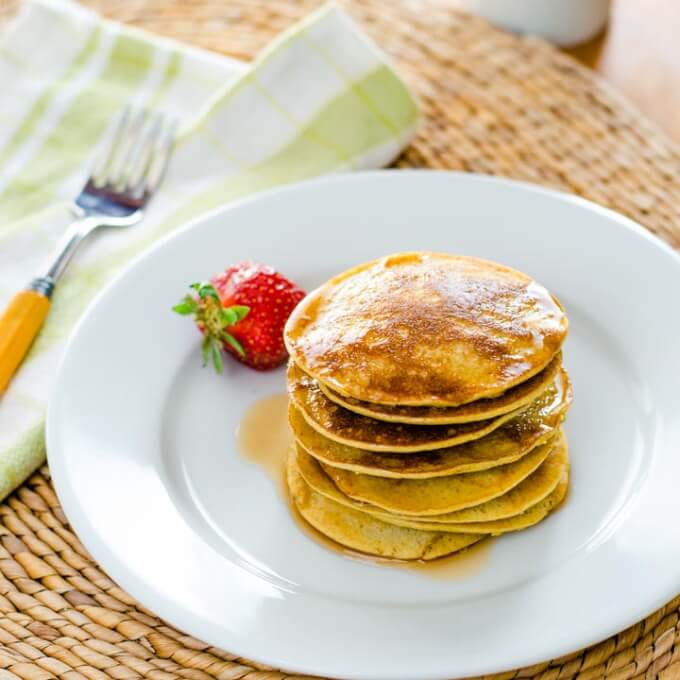 Banana pancakes with maple syrup and strawberry