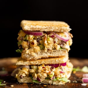 Our Chickpea Tahini Salad in a Sandwich on wood board