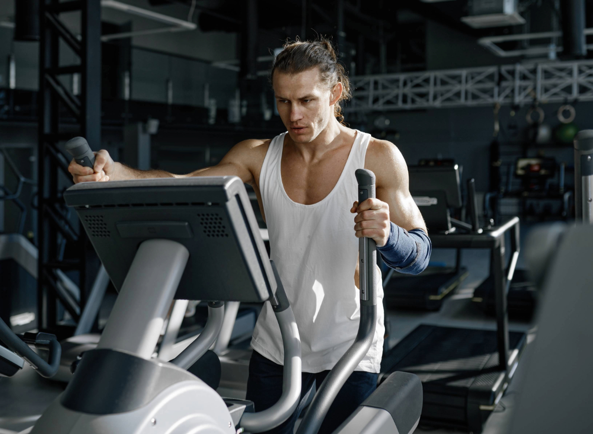 fit man using elliptical