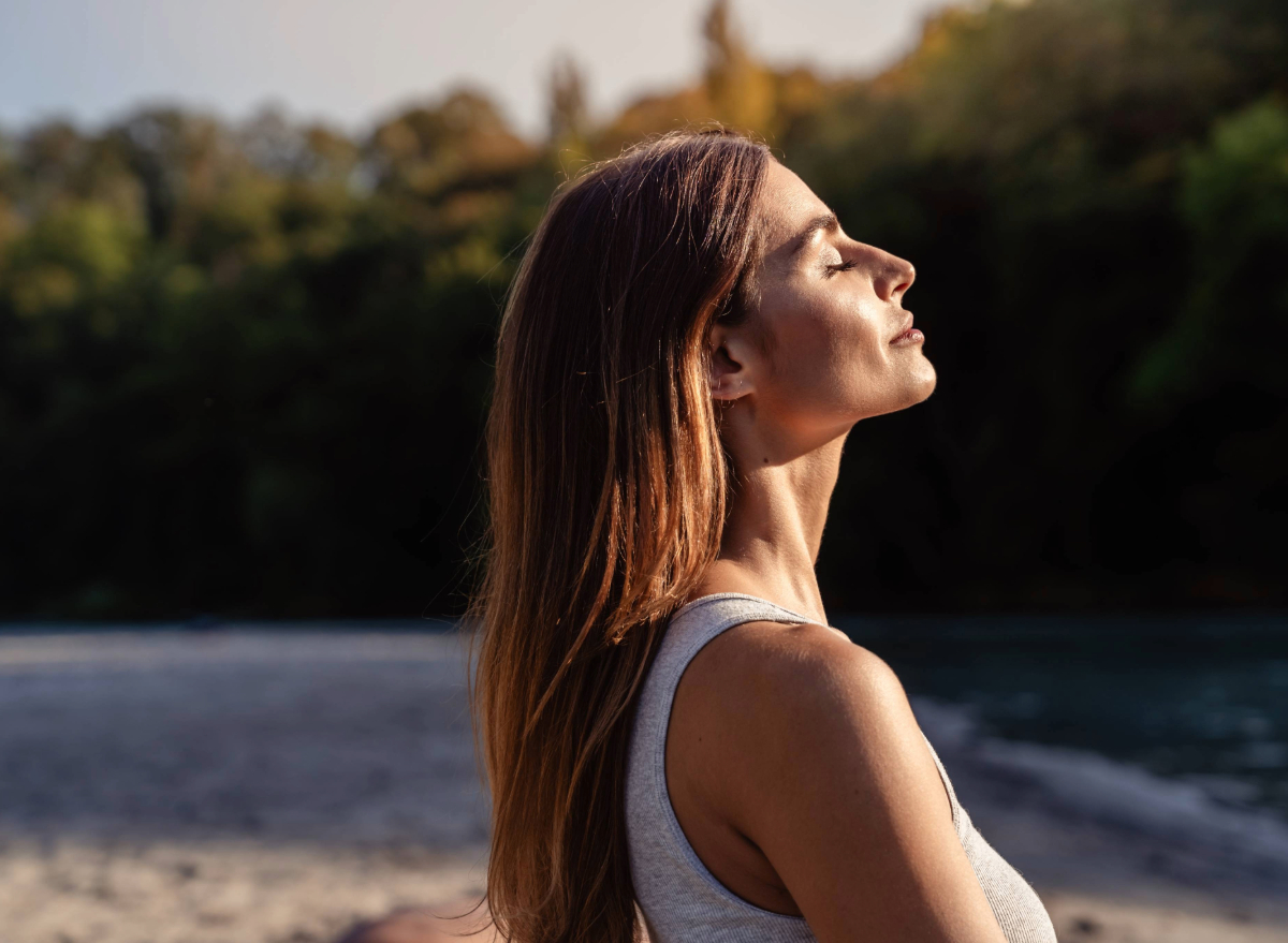 woman meditating outdoors