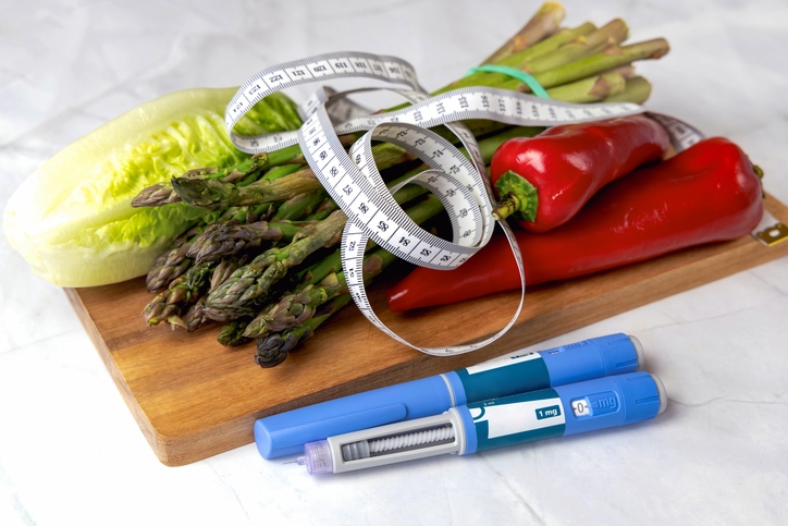 Vegetables on Cutting Board with Ozempic injectors | ozempic and exercise