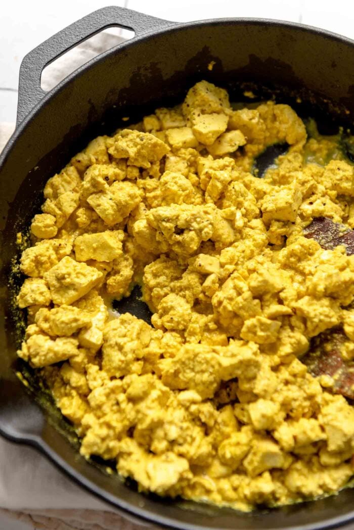 A skillet of scrambled tofu crumbles.