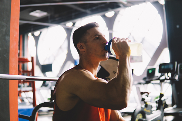 Athlete Drinks Protein in Gym | Creatine and Protein