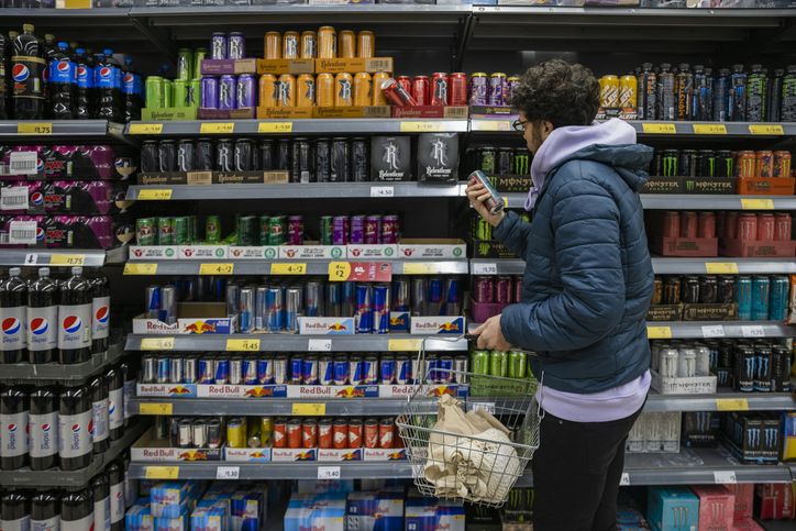 Young Man in Grocery Store | Energy Drink Before Workout