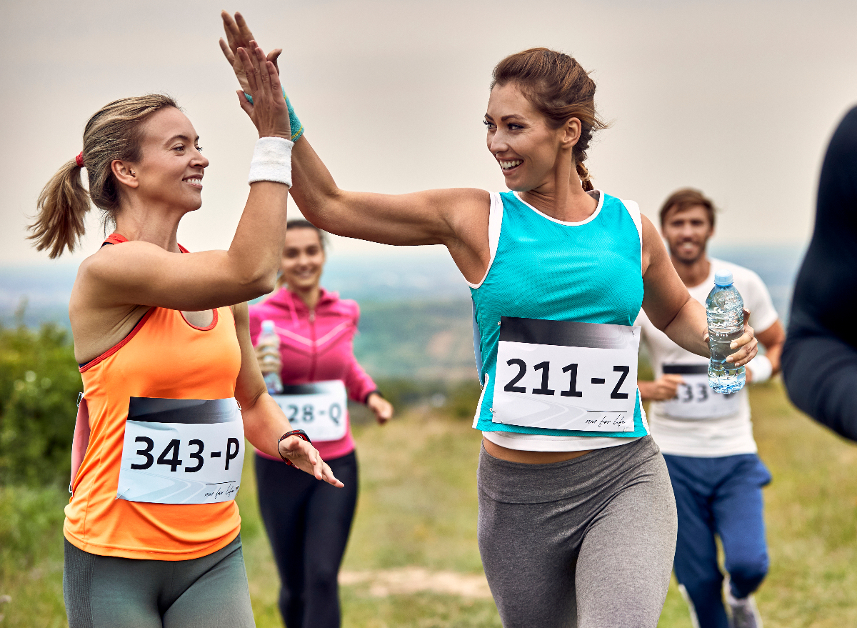 happy runners running 5K, high-five