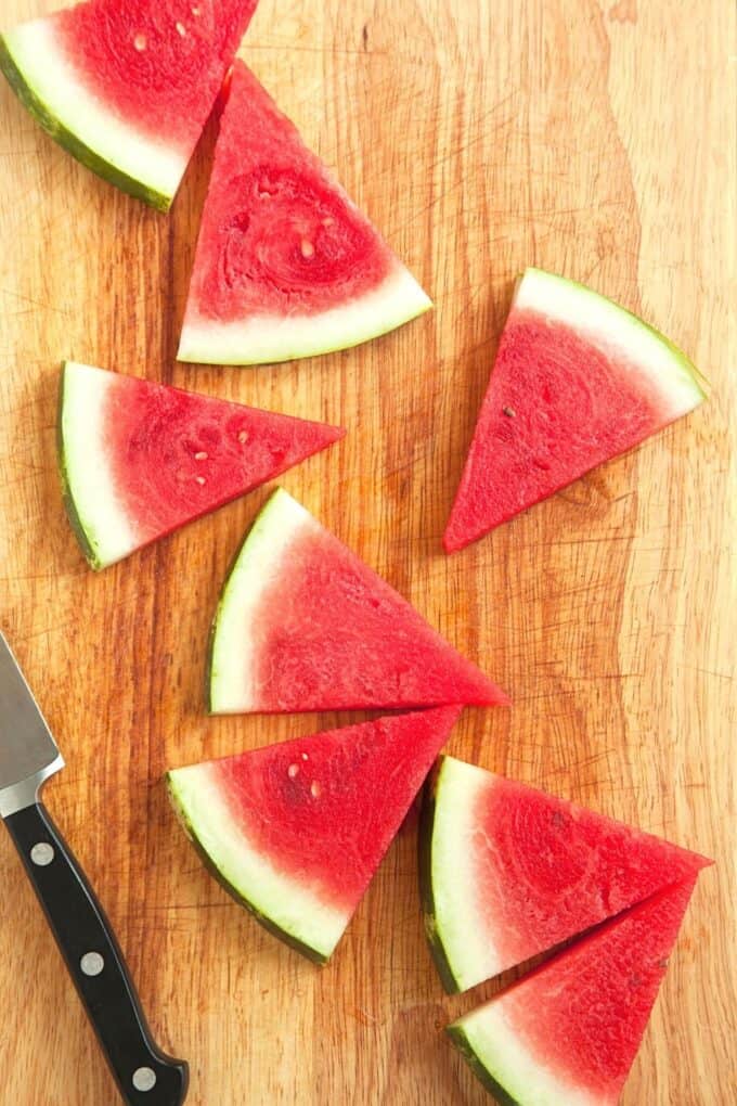 Watermelon slices on cutting board