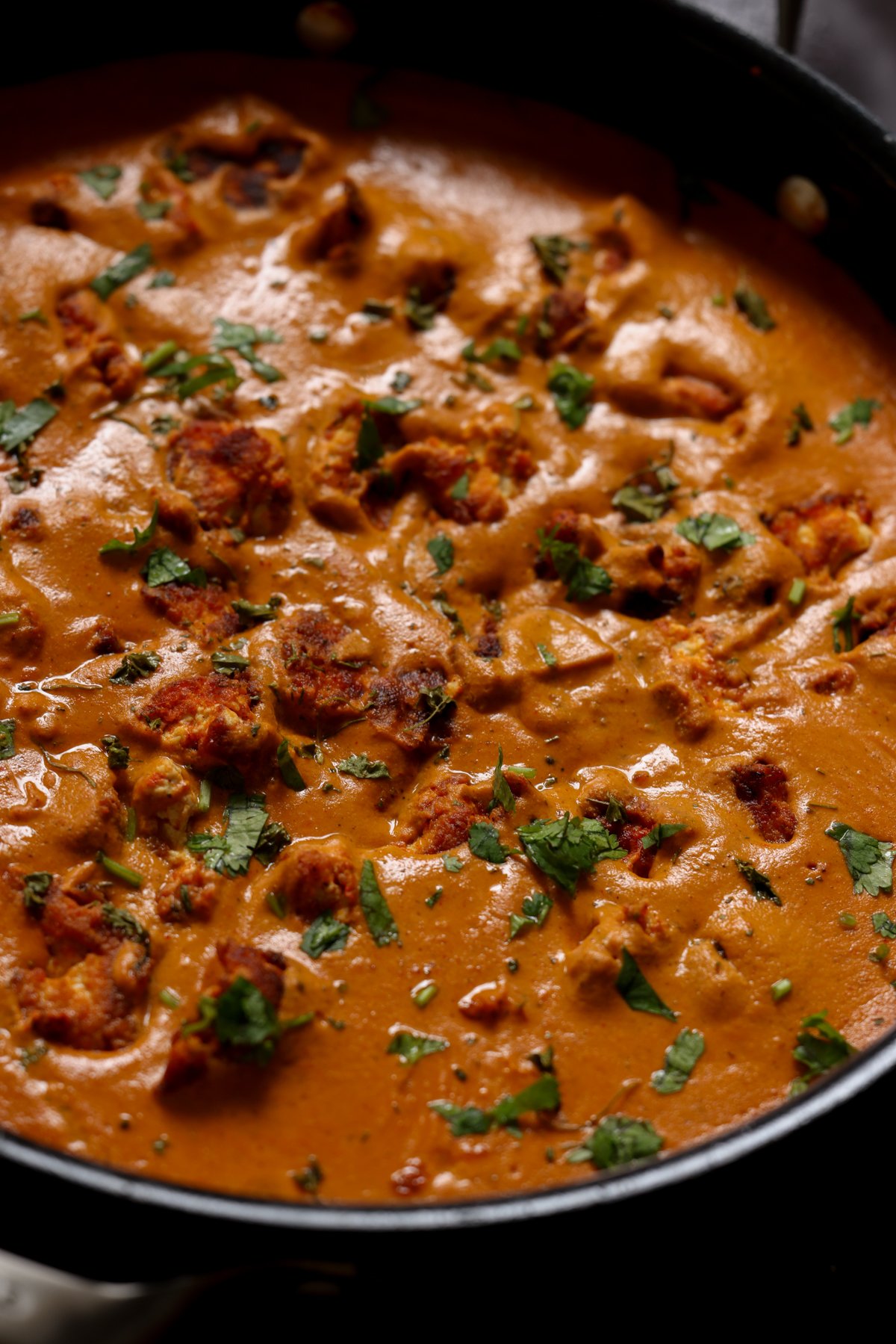 close-up of restaurant-style butter chicken in the pan