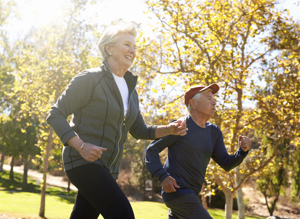 mature couple power walking, demonstrating running habits that are rapidly aging your body