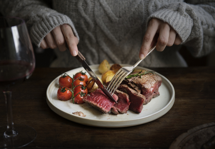 cutting a steak | How Much Protein Is Too Much