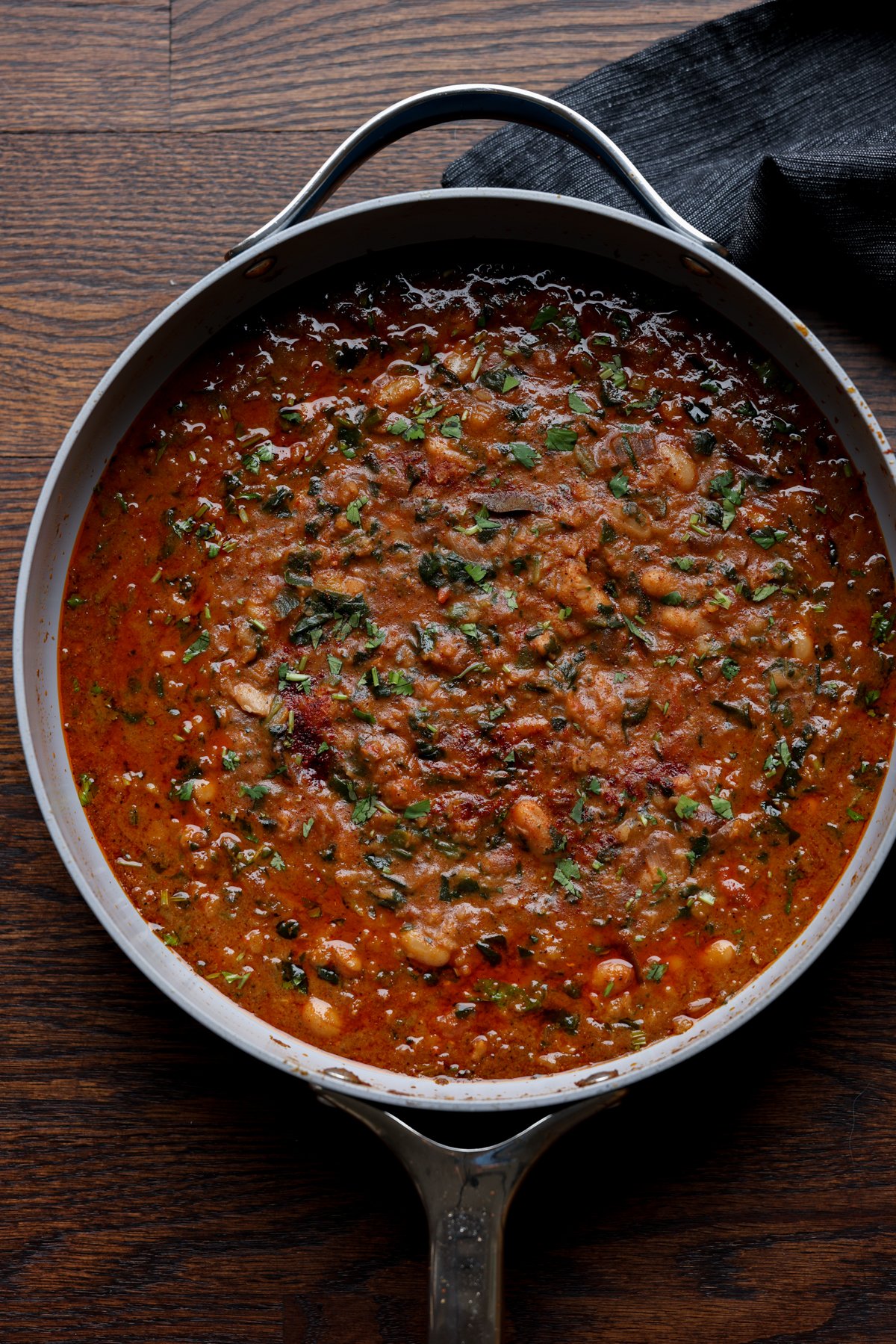 lentil bean stew in the pan after cooking and garnishing